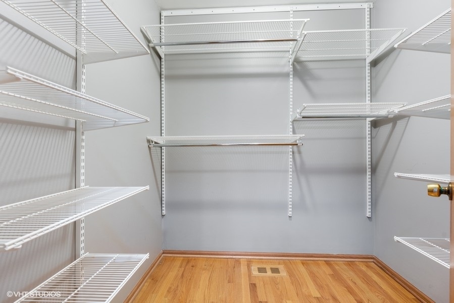 2815 South Farrell Street, Unit A Chicago, IL 60608 - Photo 12 of 18 a view of walk in closet with empty racks