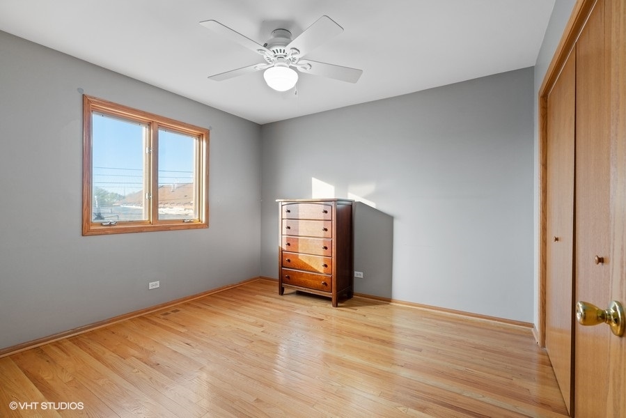 2815 South Farrell Street, Unit A Chicago, IL 60608 - Photo 14 of 18 a view of empty room with wooden floor and fan