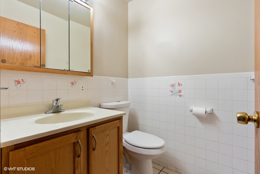 2815 South Farrell Street, Unit A Chicago, IL 60608 - Photo 15 of 18 a bathroom with a sink toilet and vanity