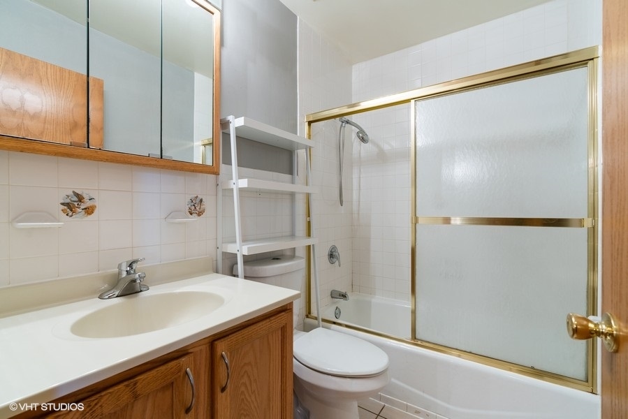 2815 South Farrell Street, Unit A Chicago, IL 60608 - Photo 16 of 18 a bathroom with a sink toilet and shower