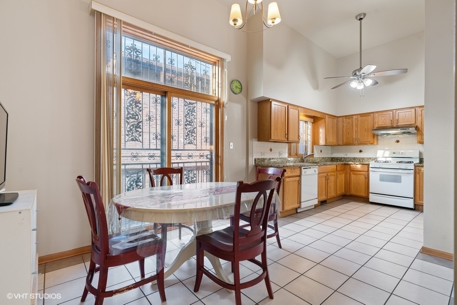 2815 South Farrell Street, Unit A Chicago, IL 60608 - Photo 9 of 18 a view of a dining room with furniture window and outside view