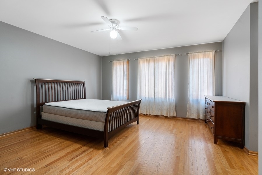 2815 South Farrell Street, Unit A Chicago, IL 60608 - Photo 10 of 18 a bedroom with a bed and wooden floor