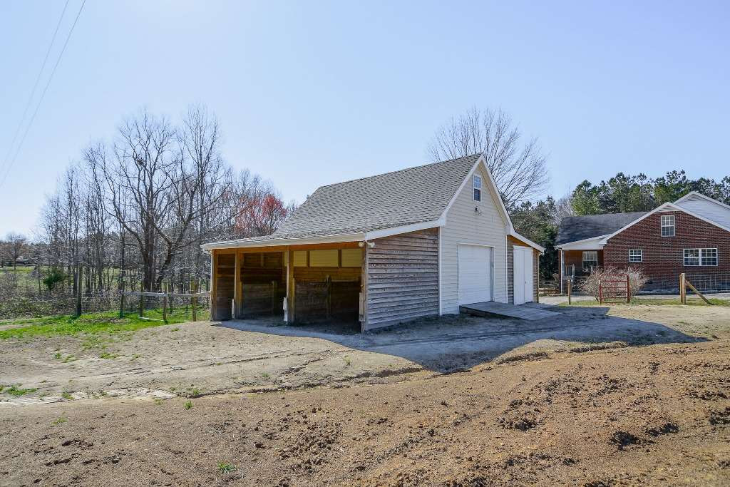 9798 Covered Bridge Road Zebulon, NC 27597 - Photo 19 of 25 3 stall feeder area