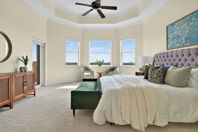 a bedroom with a bed and a painting on the wall