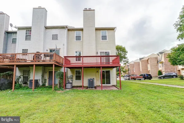a front view of a house with a garden and porch