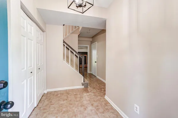 a view of a hallway view with staircase