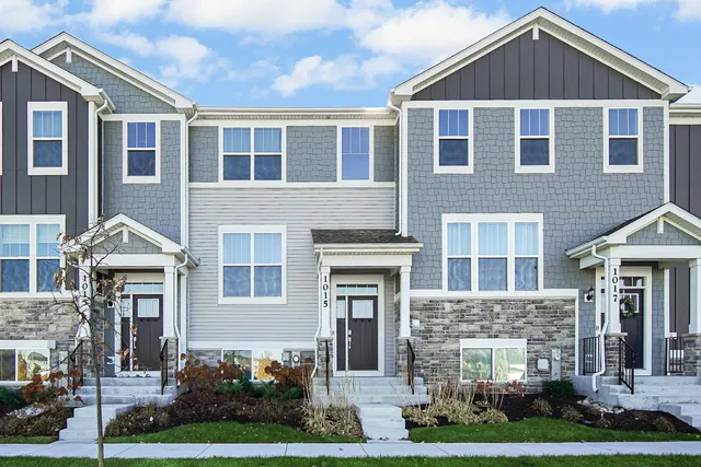 a front view of a house with yard