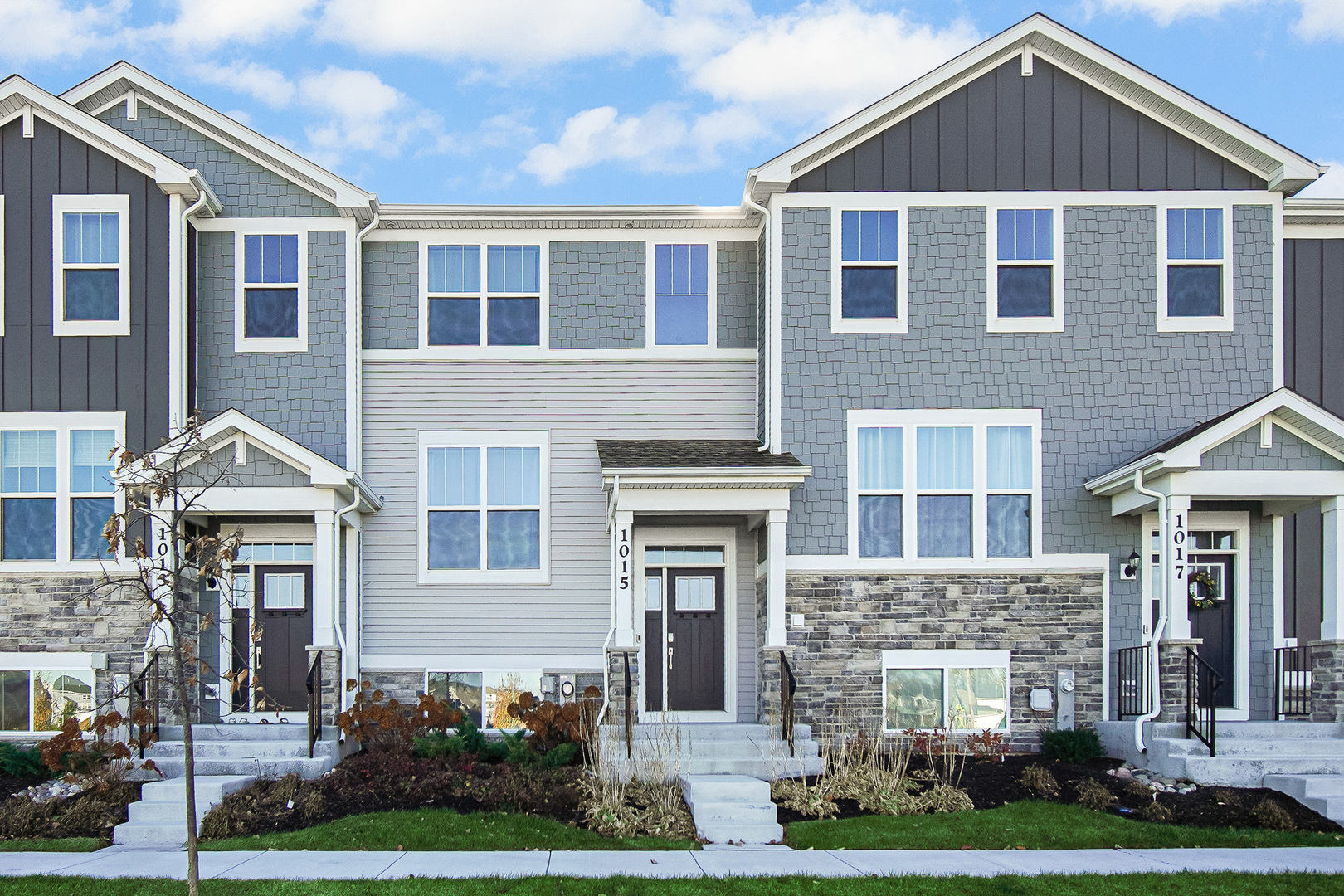 a front view of a house with yard