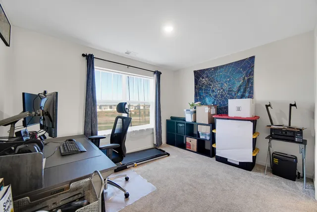 a room with furniture and musical instruments