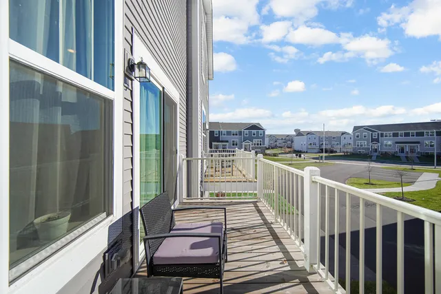 a view of a balcony with wooden floor