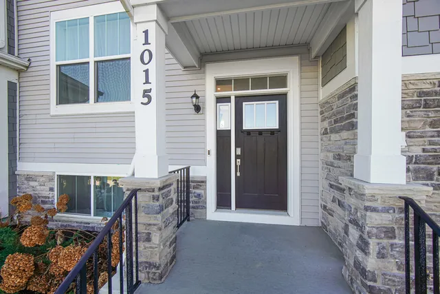 a view of front door of house and deck