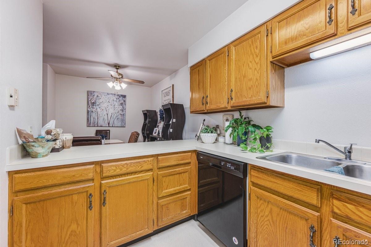 2166 35th Ave Court, Unit 14 Greeley, CO 80634 - Photo 12 of 33 a kitchen with sink and cabinets