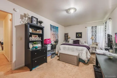 a bed room with a bed and furniture