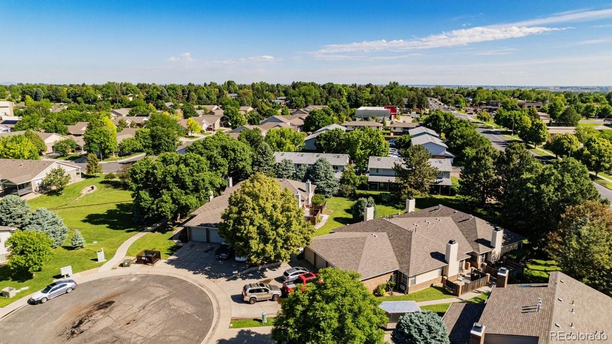 2166 35th Ave Court, Unit 14 Greeley, CO 80634 - Photo 2 of 33 an aerial view of a house with a yard