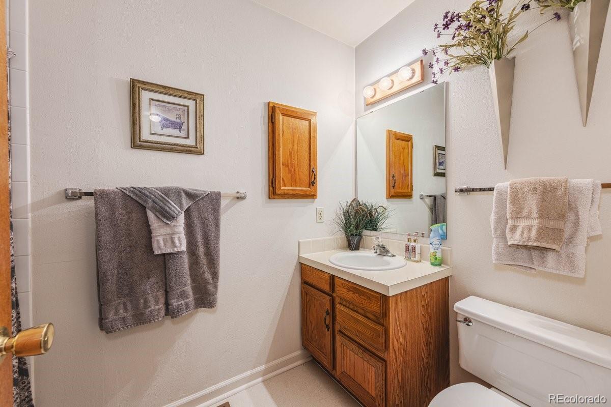 2166 35th Ave Court, Unit 14 Greeley, CO 80634 - Photo 24 of 33 a bathroom with a sink and a mirror