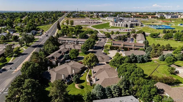 an aerial view of residential houses with outdoor space