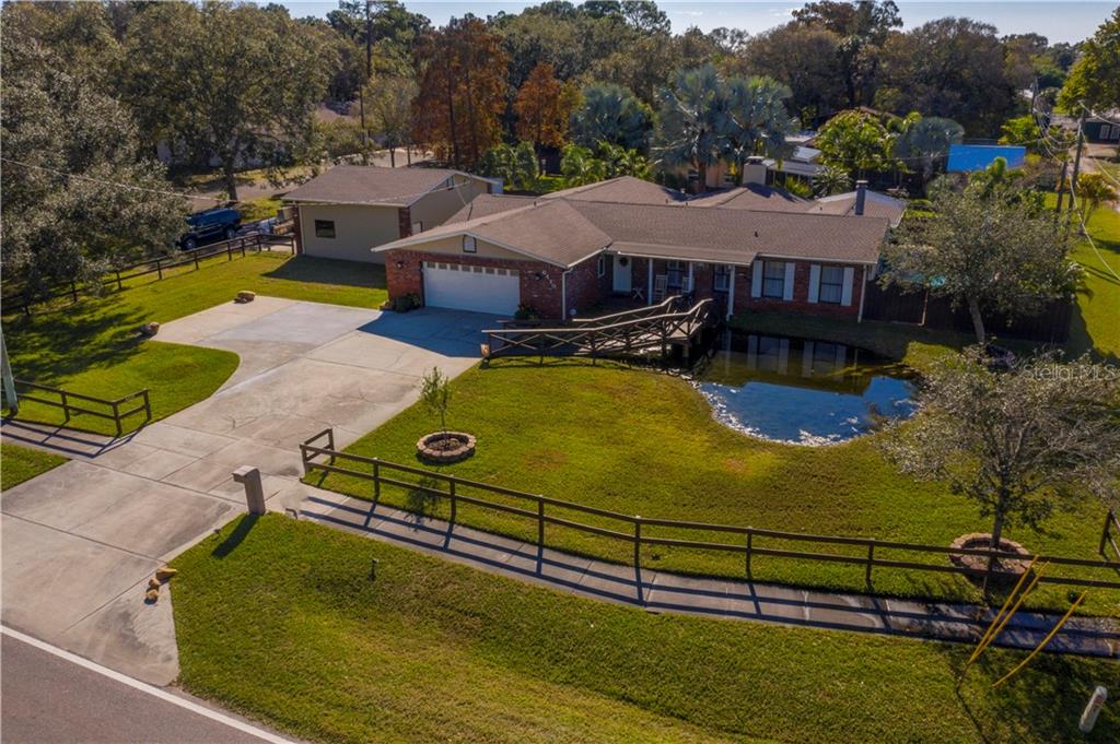 Just over a quarter of an acre with additional detached 2 car garage and a pool