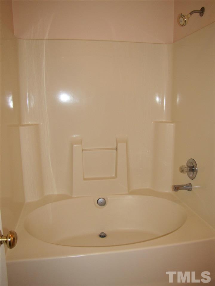 343 Rosa Circle Willow Spring, NC 27592 - Photo 14 of 22 a bathroom with a bathtub