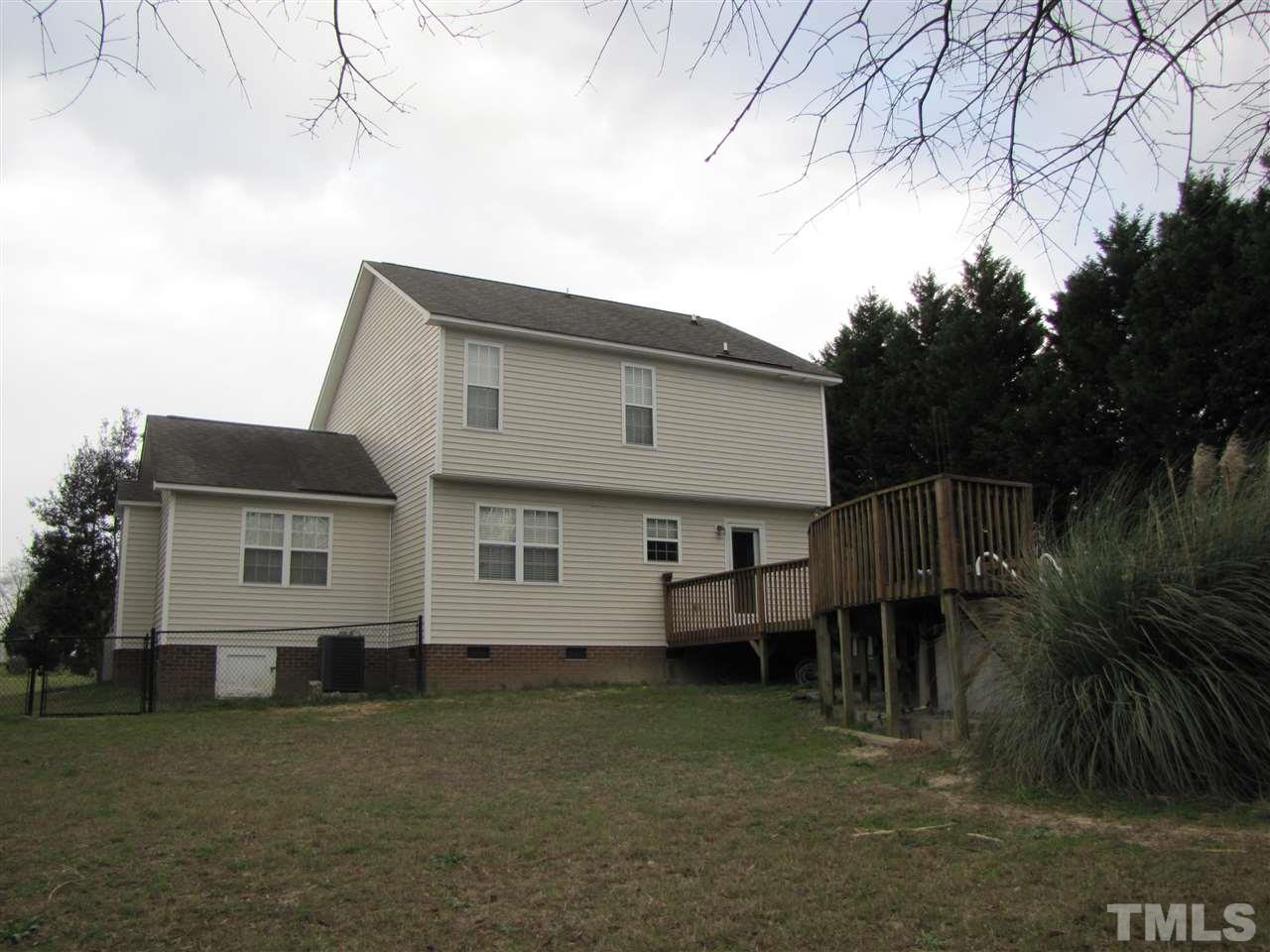 343 Rosa Circle Willow Spring, NC 27592 - Photo 3 of 22 a backyard of a house with table and chairs