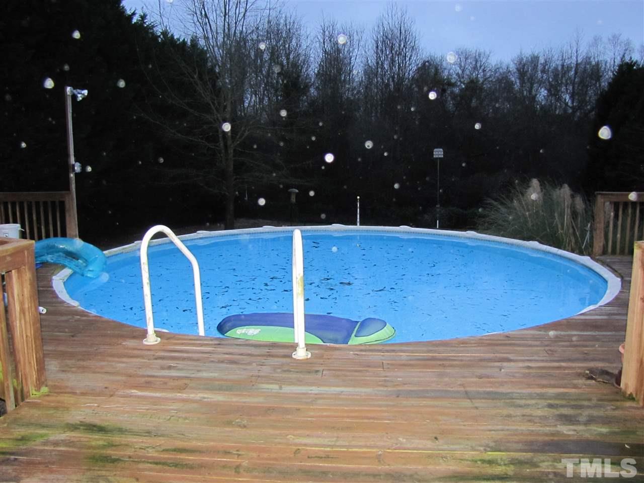 343 Rosa Circle Willow Spring, NC 27592 - Photo 22 of 22 a view of a swimming pool with a yard and outdoor seating
