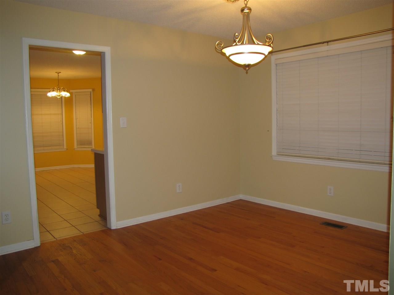 343 Rosa Circle Willow Spring, NC 27592 - Photo 8 of 22 a view of a room with wooden floor and cabinet