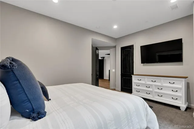 a bathroom with a double vanity sink mirror and shower