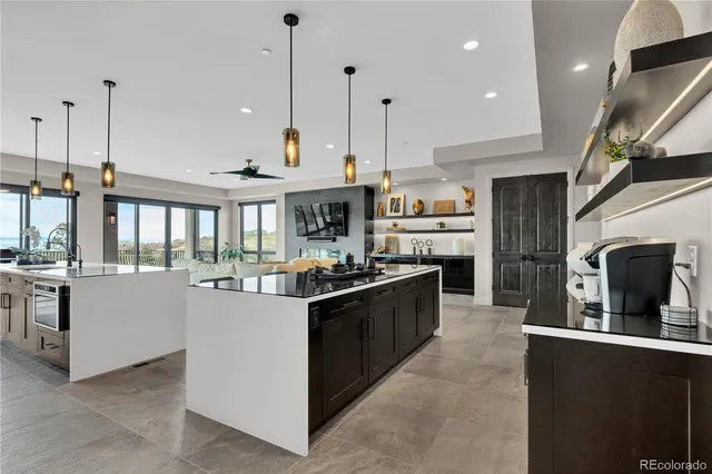 a kitchen with stainless steel appliances granite countertop a stove and a sink