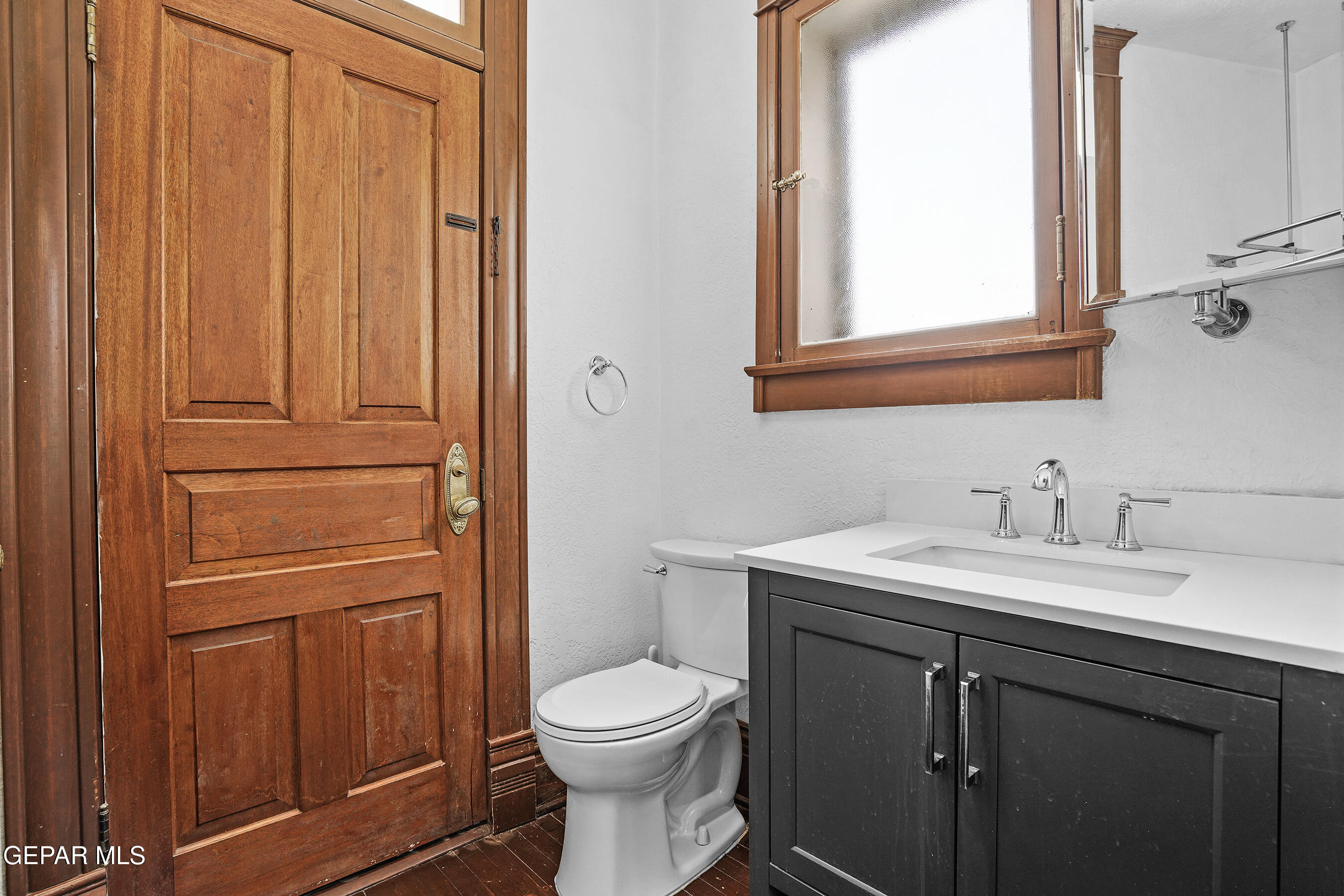 1218 Prospect Street El Paso, TX 79902 - Photo 13 of 43 a bathroom with a sink a toilet and a mirror