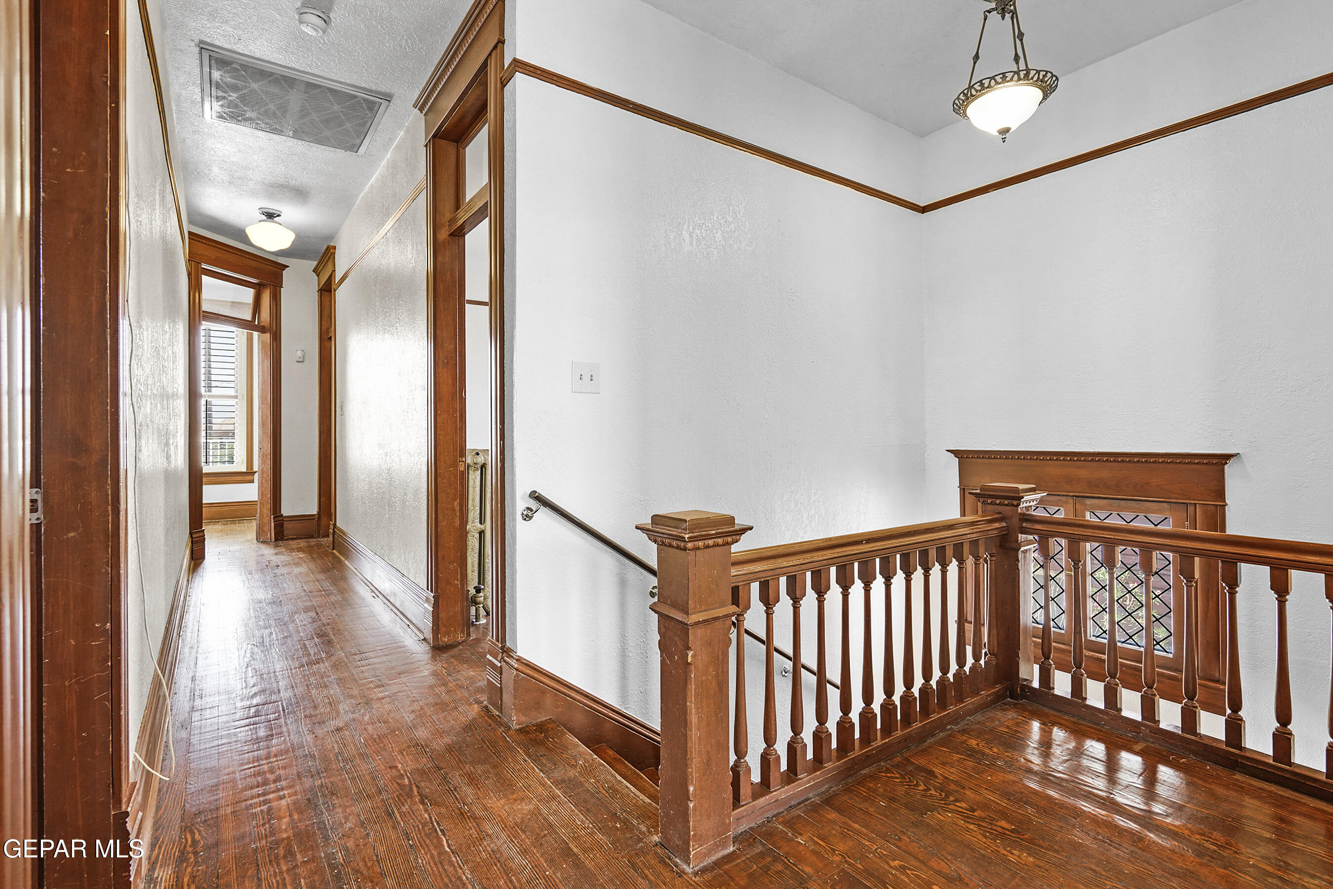 1218 Prospect Street El Paso, TX 79902 - Photo 19 of 43 a view of a hallway with wooden floor and entryway