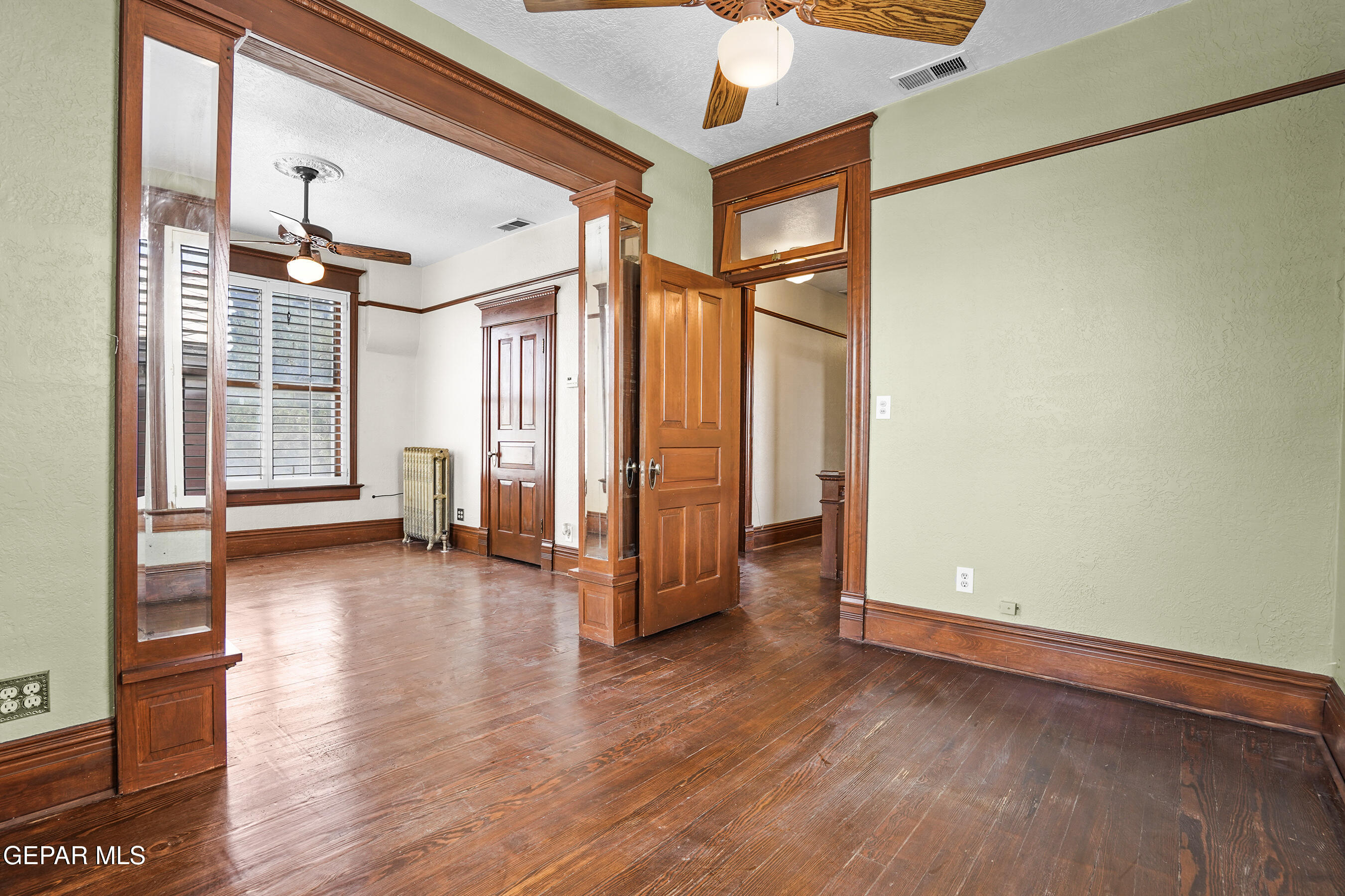 1218 Prospect Street El Paso, TX 79902 - Photo 21 of 43 wooden floor in an empty room with a window