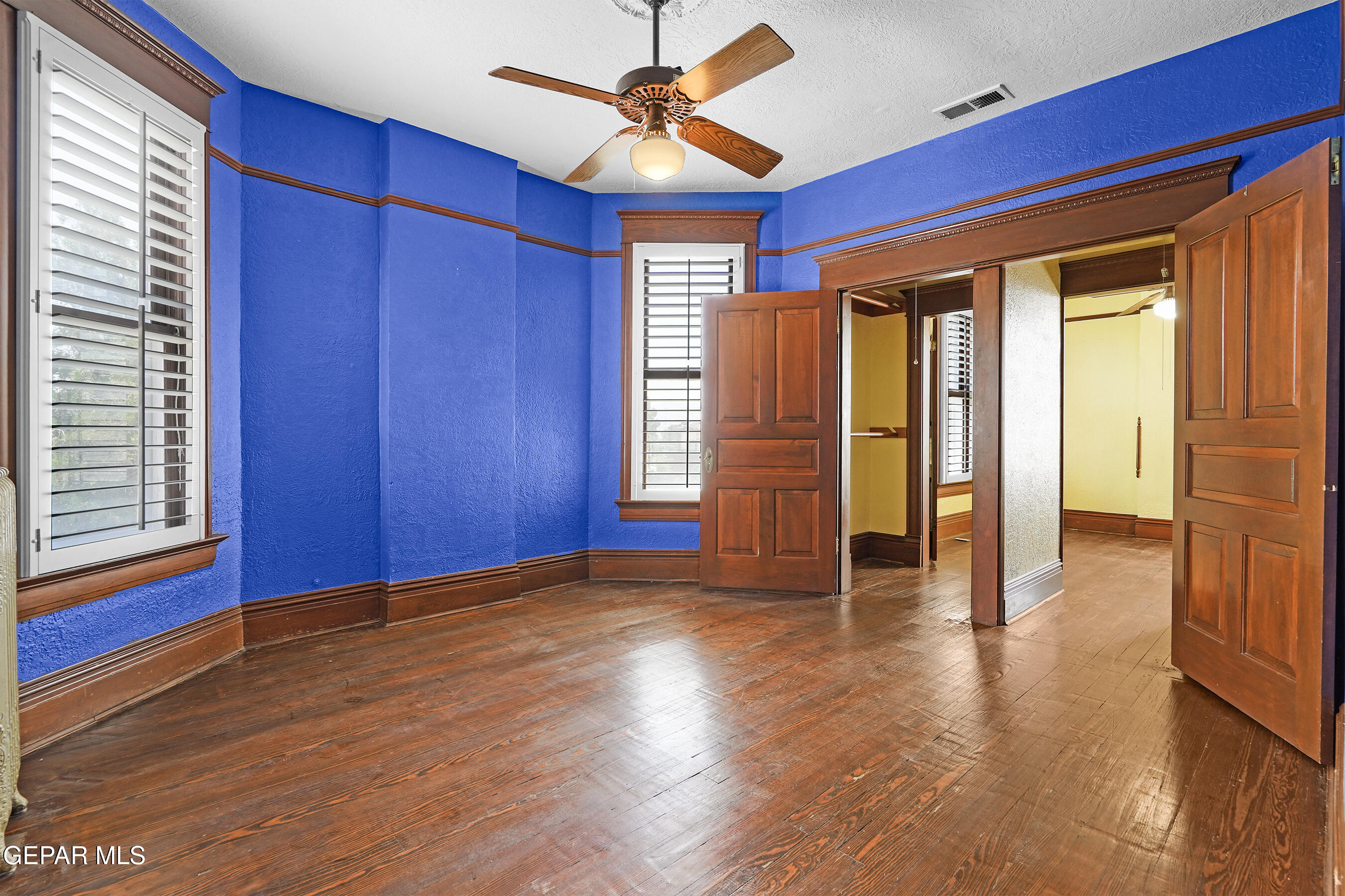 1218 Prospect Street El Paso, TX 79902 - Photo 25 of 43 a view of empty room with wooden floor and fan
