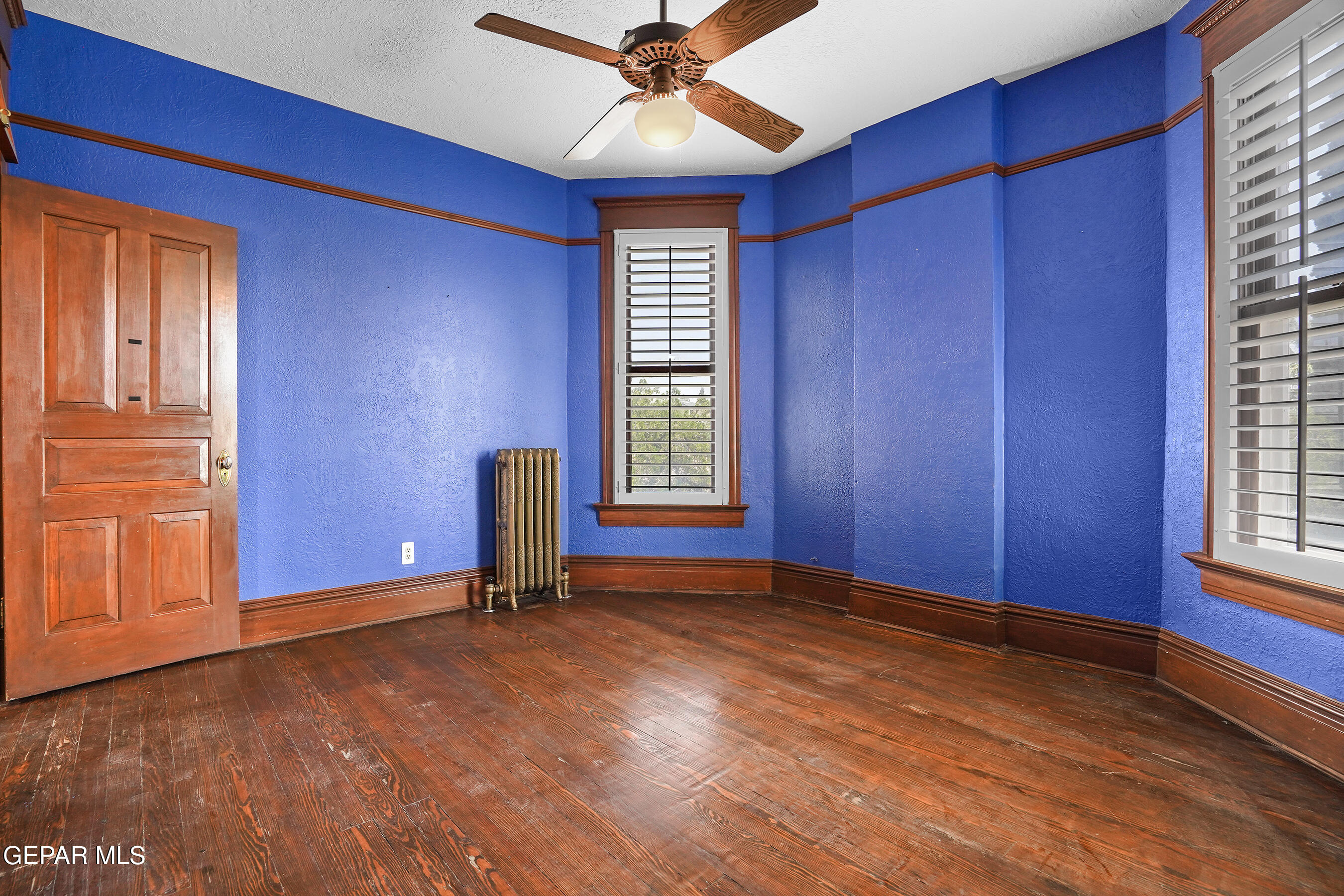 1218 Prospect Street El Paso, TX 79902 - Photo 26 of 43 a view of an empty room with window and wooden floor