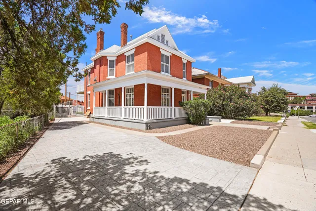 a view of an entryway with wooden floor and door