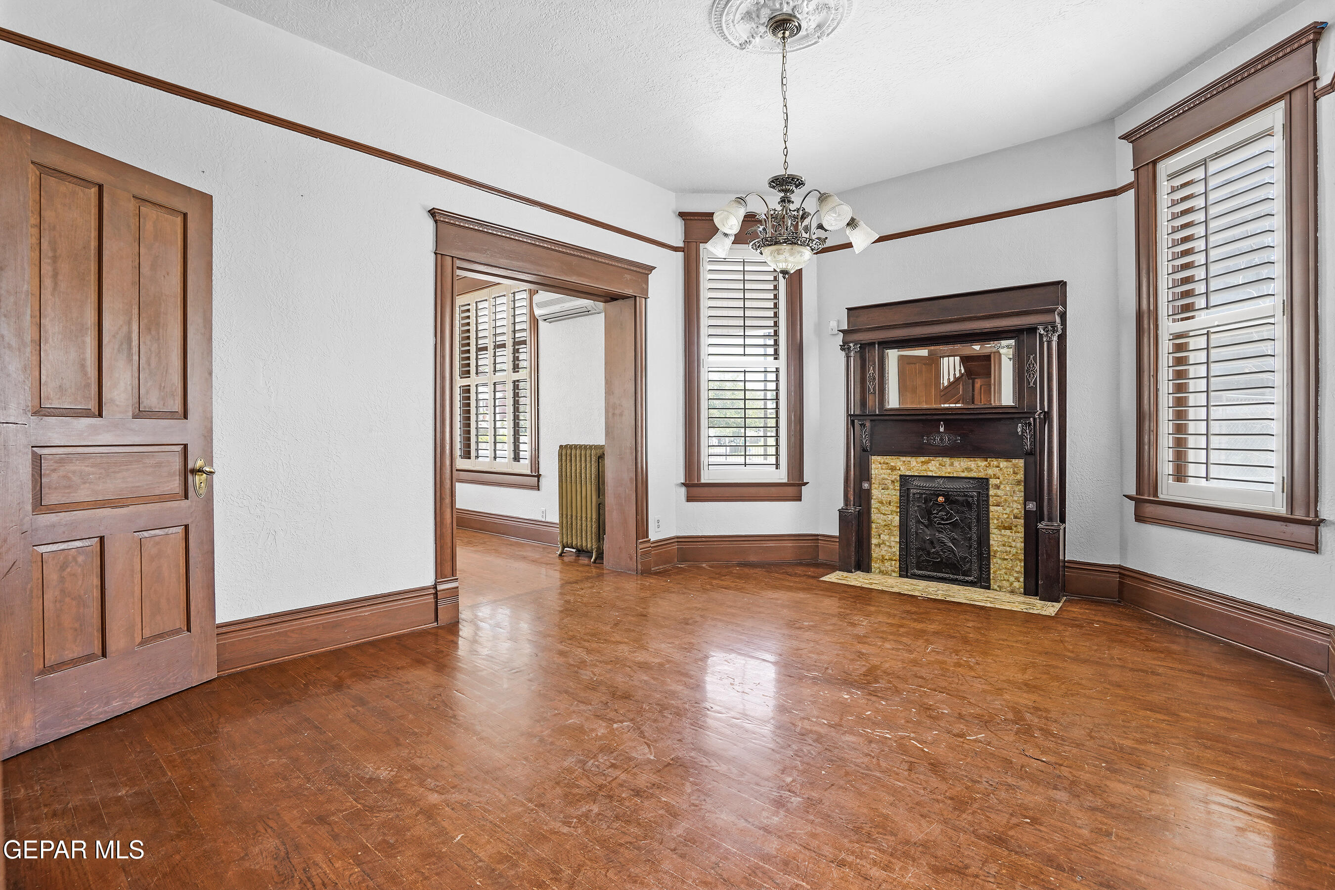 1218 Prospect Street El Paso, TX 79902 - Photo 10 of 43 a view of an empty room with a fireplace and a window