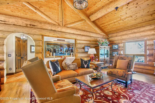 a living room with furniture and a table