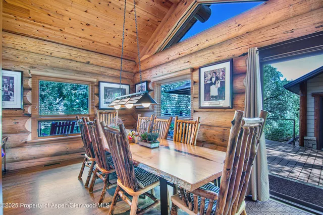 a view of an outside dining space with furniture