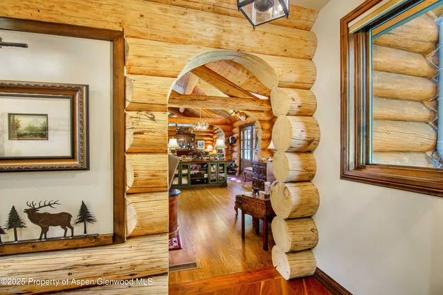 a view of a entryway with wooden floor and a couch