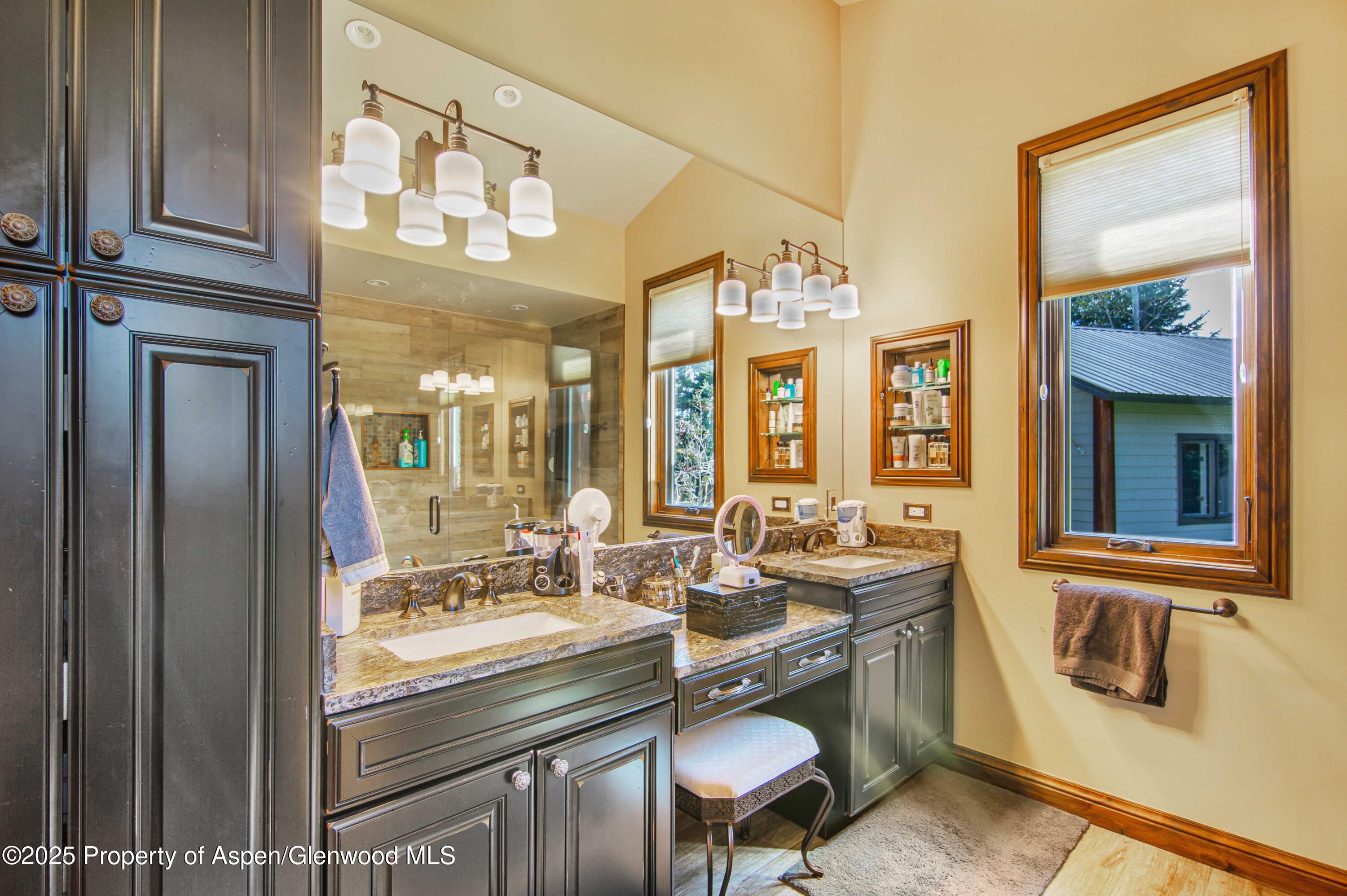 1637 Emma Spur Basalt, CO 81621 - Photo 23 of 45 a bathroom with a sink and a mirror