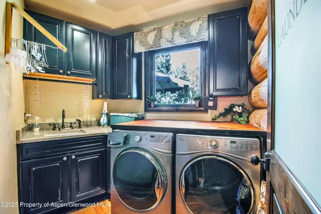 a view of a sink and mirror with window