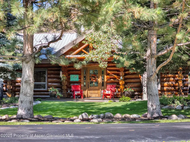 a view of a garage with a table and a chairs