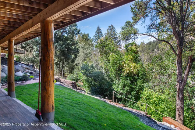 a view of a porch with a yard