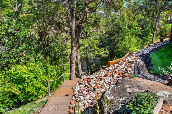 a spacious bedroom with a bed and a large window