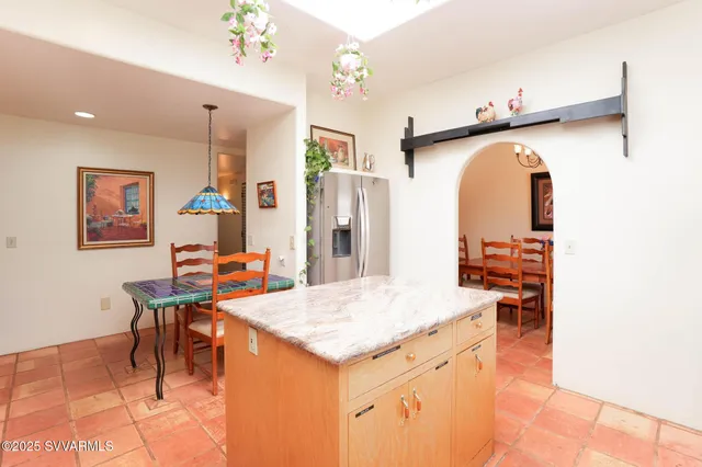 a large tub sitting in a bathroom next to a window