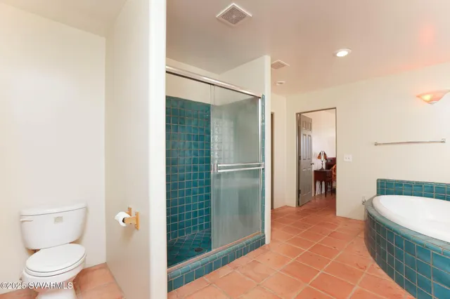 a spacious bathroom with a granite countertop sink and a mirror