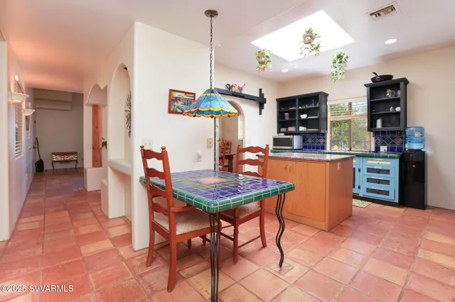 a kitchen with stainless steel appliances granite countertop a sink and a stove