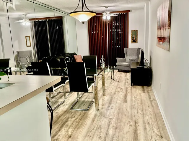a bathroom with a sink vanity and a mirror