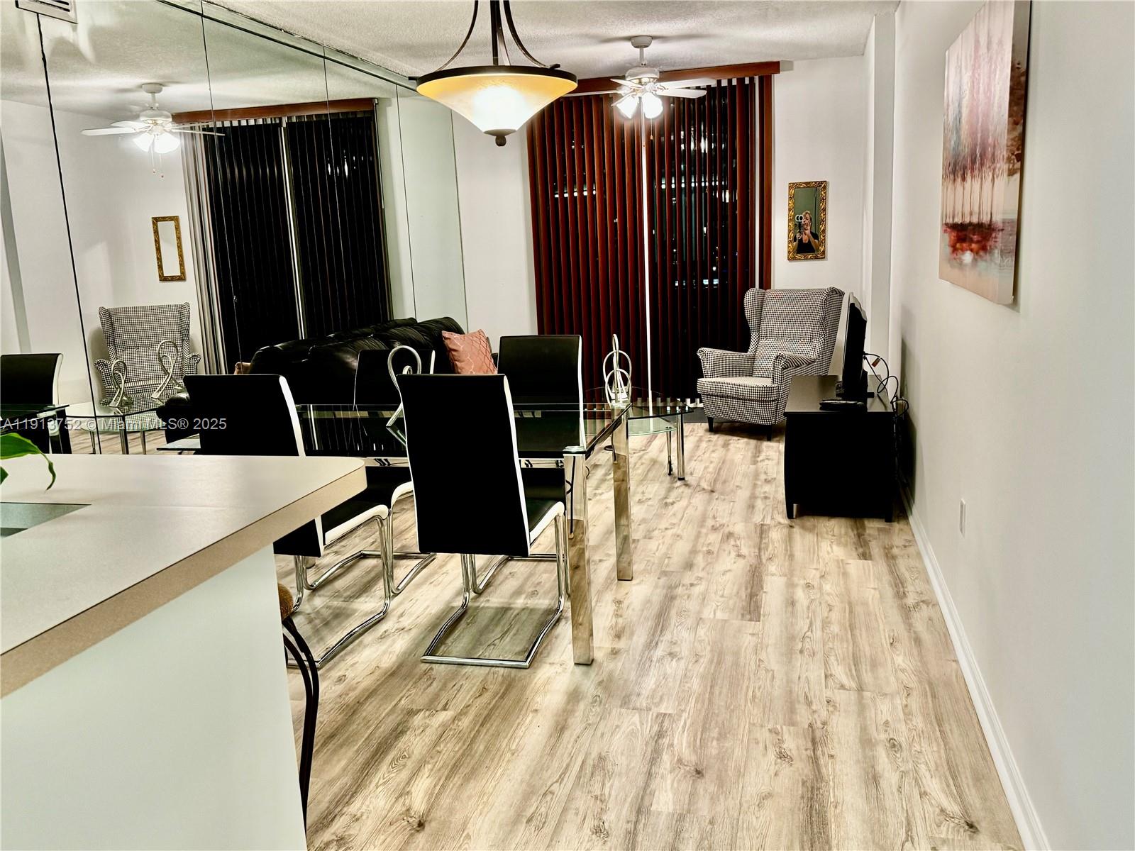 a bathroom with a sink vanity and a mirror