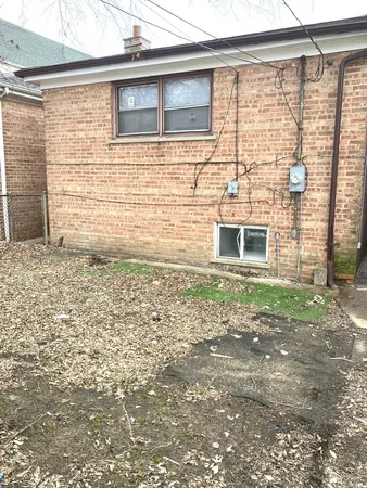 a side view of a house with a yard