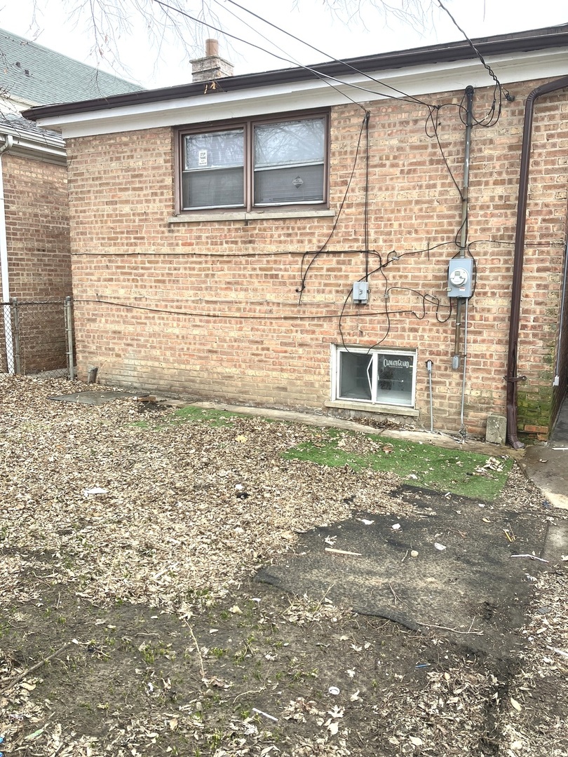 840 East 89th Street Chicago, IL 60619 - Photo 24 of 27 a view of house with backyard