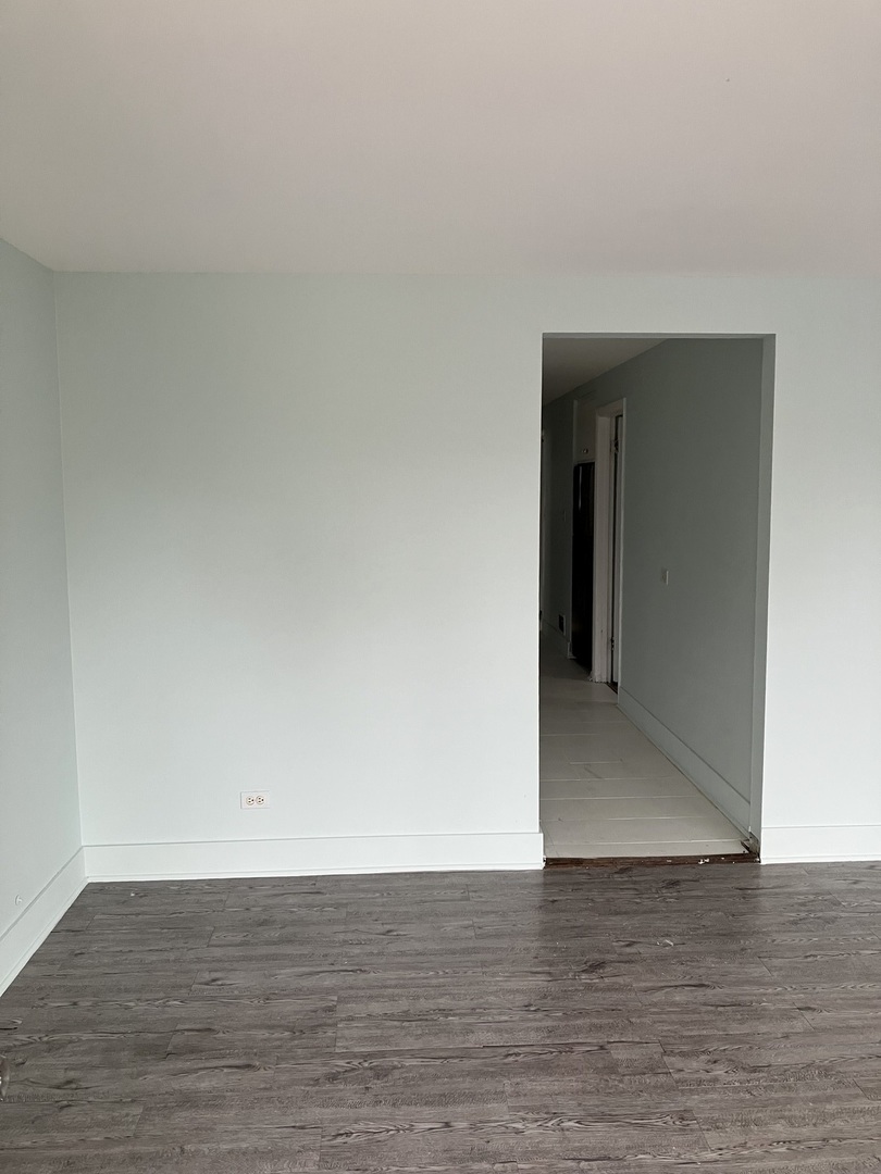 840 East 89th Street Chicago, IL 60619 - Photo 5 of 27 a view of an empty room and wooden floor